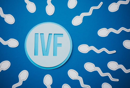 IVF graphic with sperm surrounding an egg
