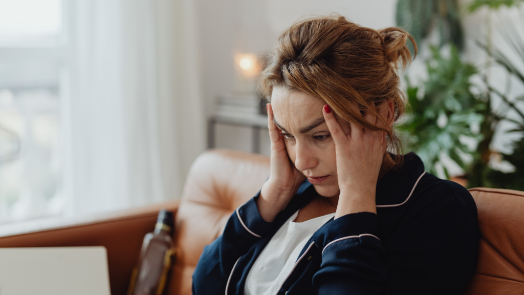 Woman holding her head headache