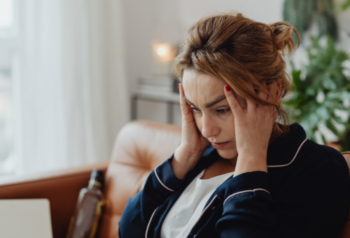 Woman holding her head headache