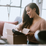 Woman opening a package gift amazon