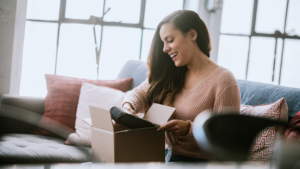 Woman opening a package gift amazon